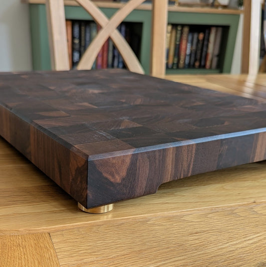 custom chopping board with brass chopping board feet, also known as brass cutting board feet.